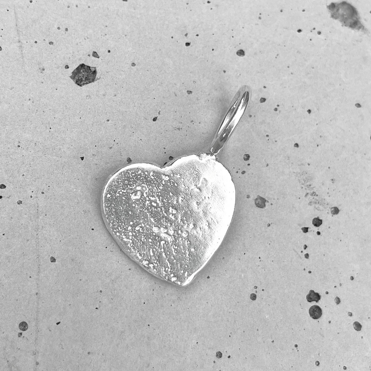 one of a kind small silver heart sandcast charm