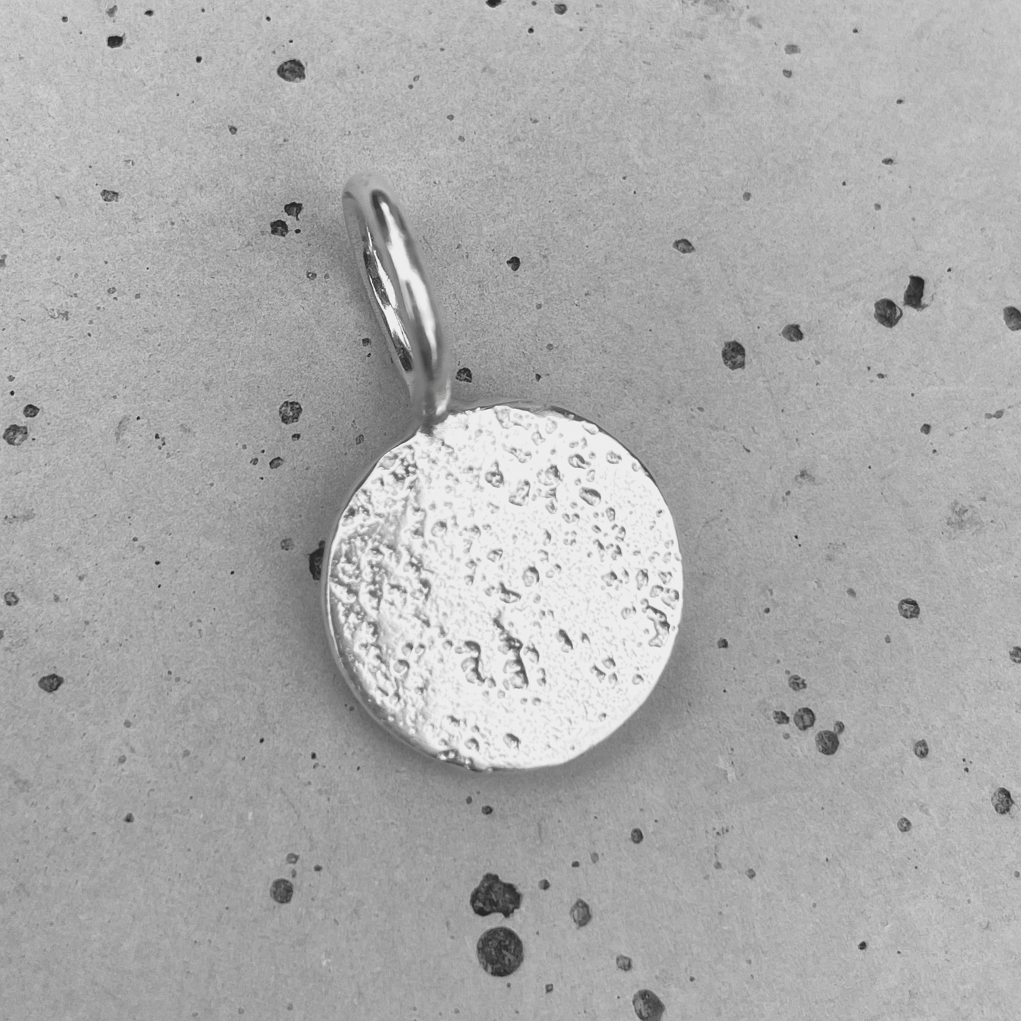textured small round sandcast pendant charm