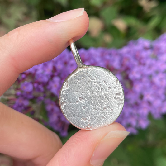 large round unique silver organic medallion sandcast charm