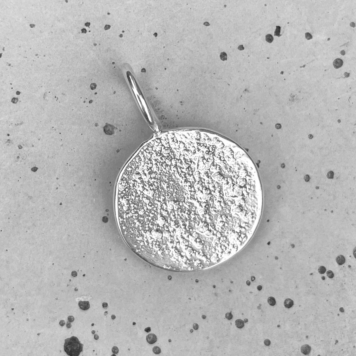 large round unique silver organic medallion sandcast charm